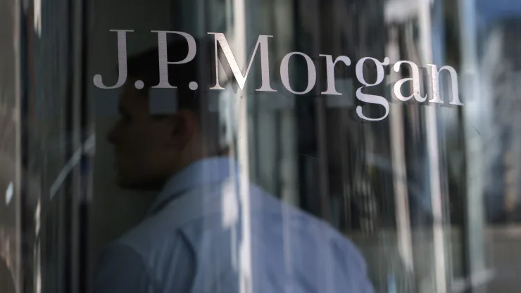 The stocks making the biggest moves on the premarket: JPMorgan, Virgin Galactic, Tesla and others.